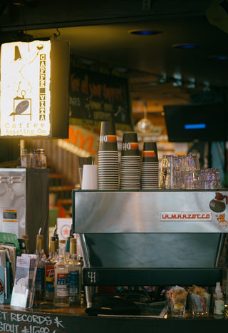 Espresso machine with Vita cups and light box sign in a Vita wholesale customer cafe