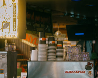 Espresso machine with Vita cups and light box sign in a Vita wholesale customer cafe