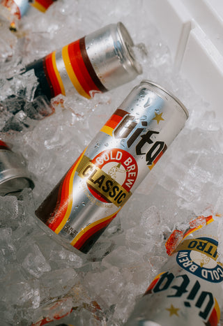 Cans of Cold Brew Classic and Cold Brew Nitro in bucket of ice