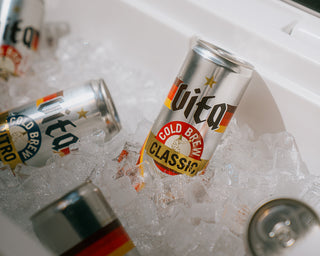 Cans of Cold Brew Classic and Cold Brew Nitro in bucket of ice