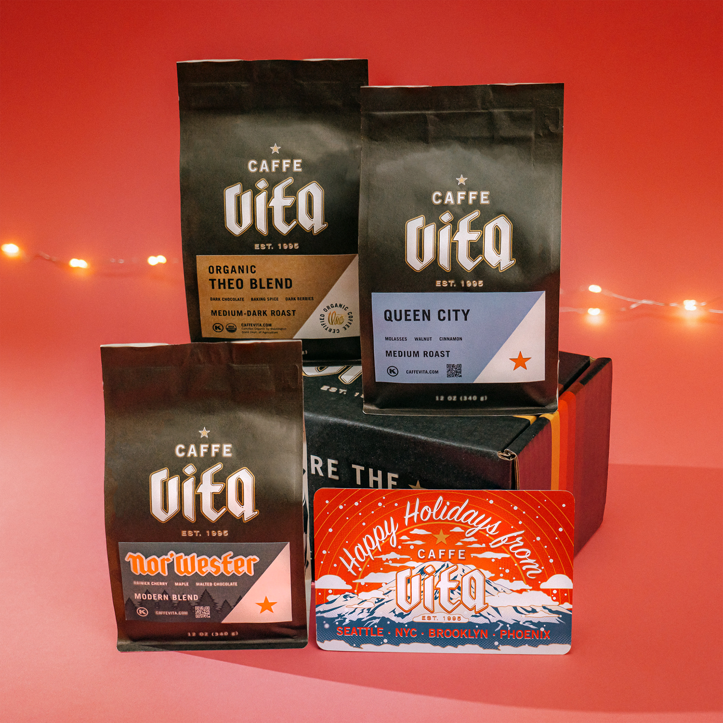 Nor'wester, theo, and queen city blends on sunset box with postcard assembled over red background with tree lights.
