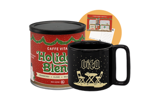 Caffe Vita Holiday Blend coffee canister and black mug and postcard