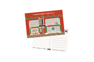 Postcard with a festive design of a building and 'Warm Wishes, From Vita' text.