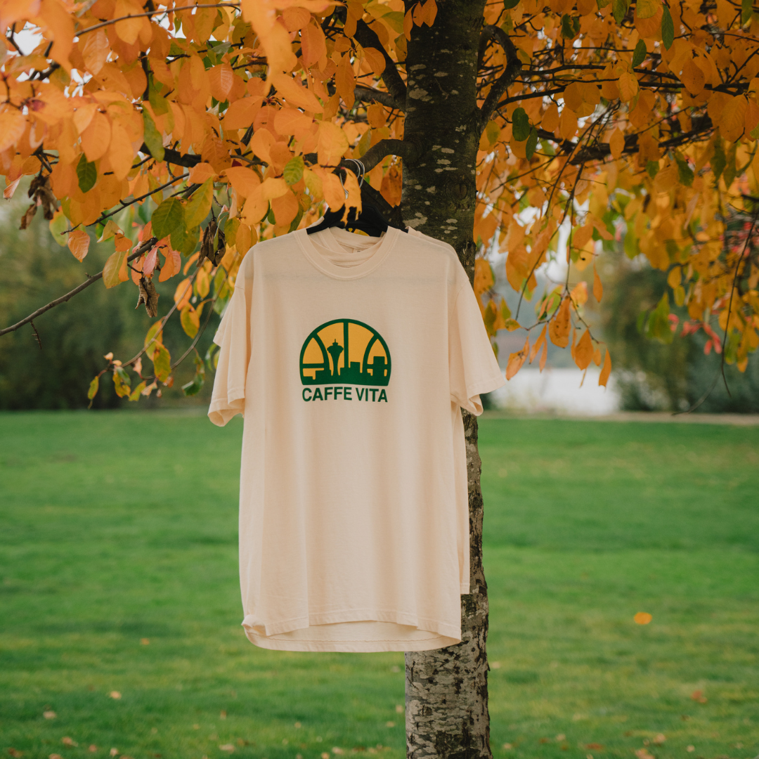 Image: sonics tee hanging in tree with yellow leaves.