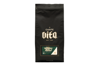 Black coffee bag with 'Caffe Vita' branding .