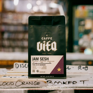 Jam Sesh bag centered on top of record stacks in a record store.