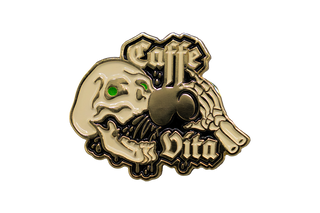 Enamel pin of skull with green eyes drinking coffee and Caffe Vita logo