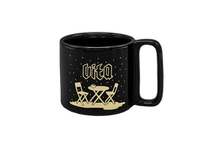Black mug with 'vita' and table chair design in white, no background