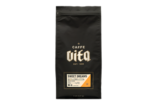 Black coffee bag with 'Caffe Vita' branding labeled Sweet Dreams